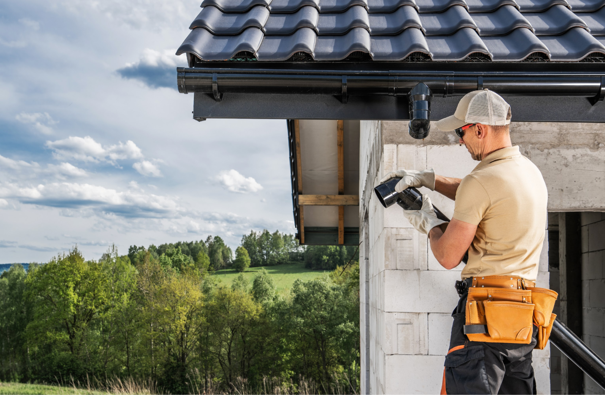 A man working on gutters.