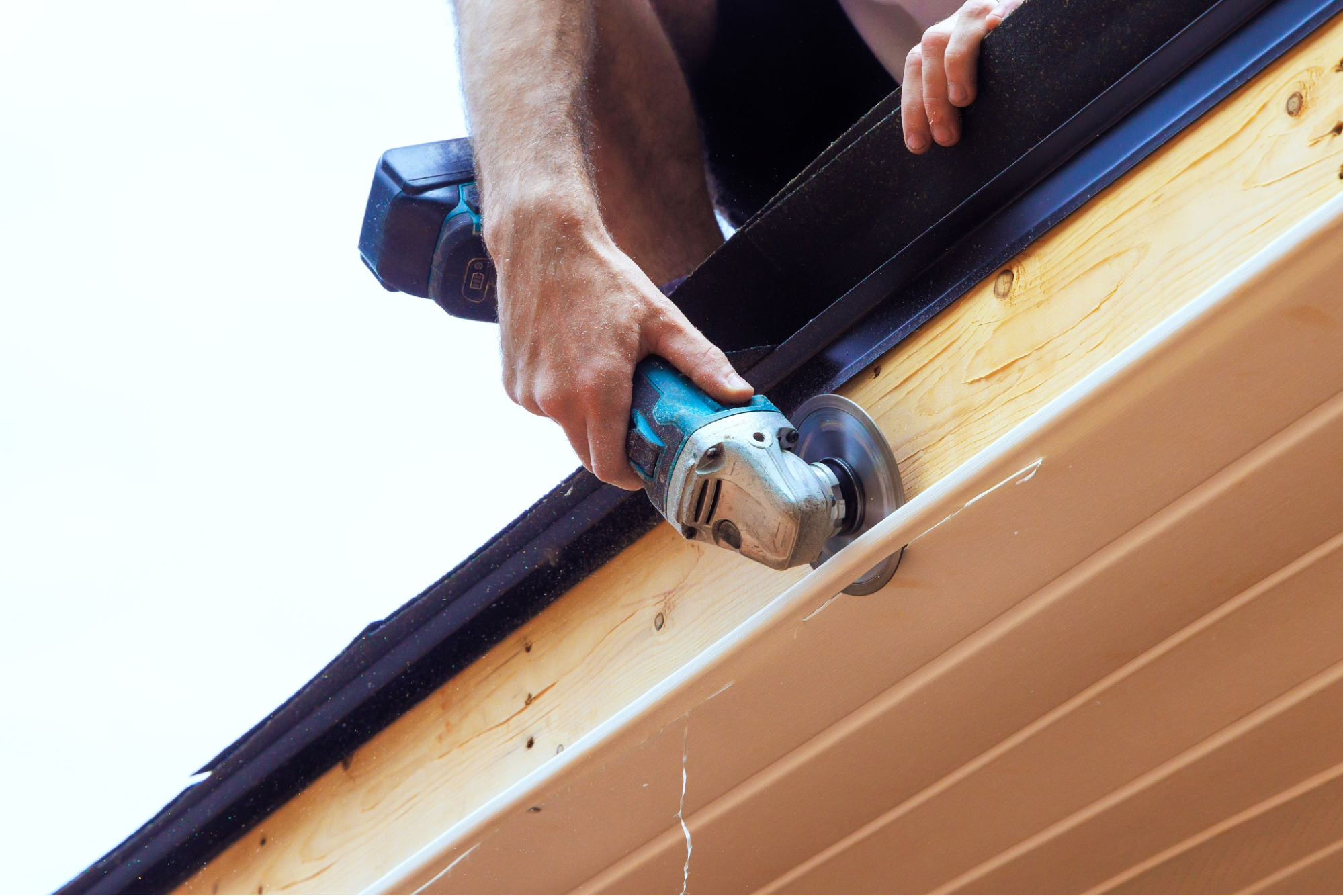 A contractor trimming a soffit.
