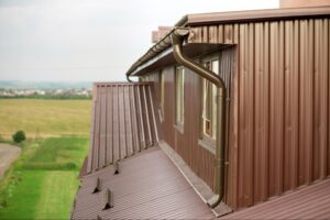Modern building with professionally installed roof and rain gutter system for effective water drainage and property protection